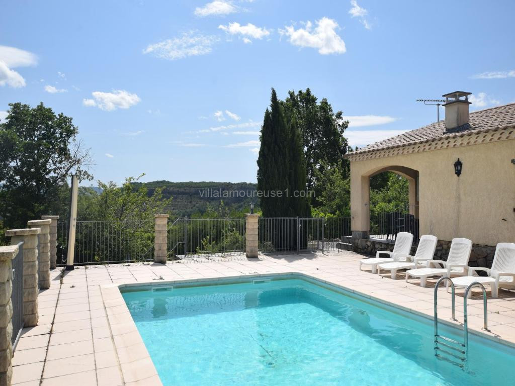 Photo de Quiet holiday home in Les Vans with pool, cleaning included