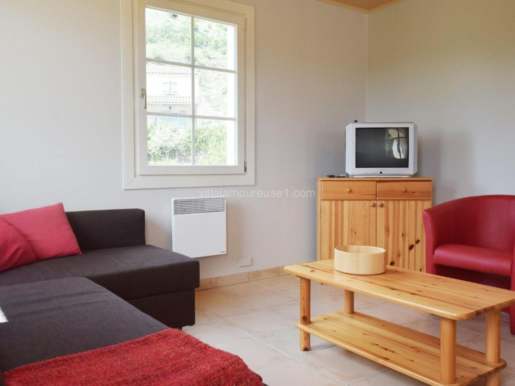 Photo de Quiet holiday home in Les Vans with pool